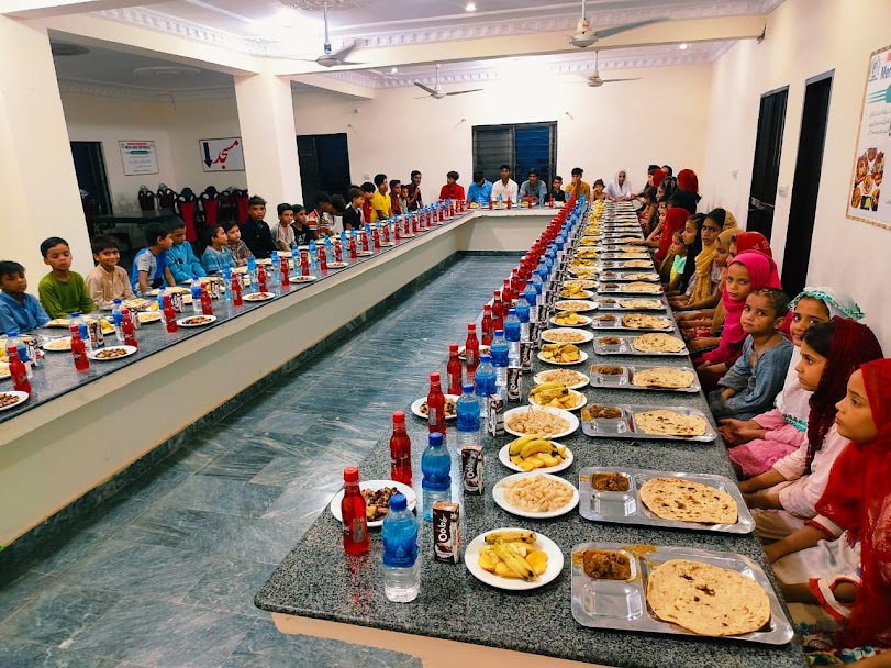 Children sharing a family meal at Mera Ghar Orphanage